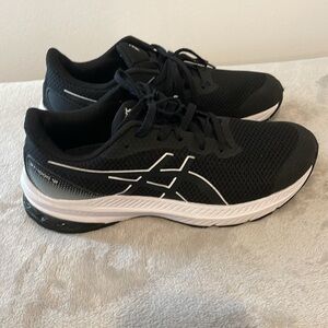 Kid’s GT - 1000 12 GS ASICS. Size 4.4 Color Black/White.